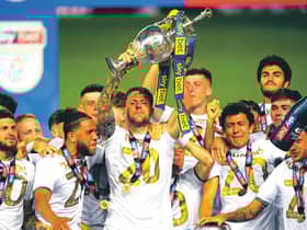 As captain of Leeds United, Liam Cooper lifts the Championship trophy. Picture: Michael Regan/Getty Images