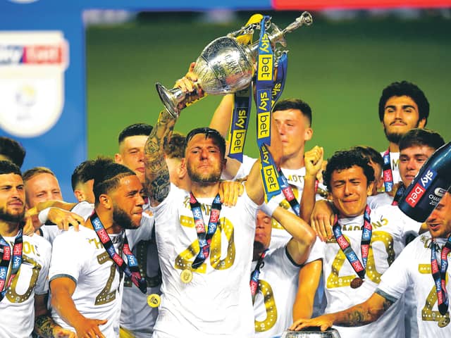 As captain of Leeds United, Liam Cooper lifts the Championship trophy. Picture: Michael Regan/Getty Images