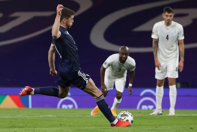 Scotland's Ryan Christie confidently strokes home the penalty just before half-time. Picture: Andrew Milligan/PA Wire