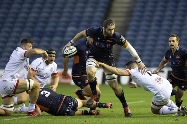 Ben Toolis attempts to escape the attentions of Ulster's James Hume. Picture: Craig Williamson/SNS