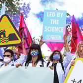 Extinction Rebellion protesters make the point that their calls for greater action are backed by scientists (Picture: Luciana Guerra/PA Wire)