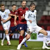 Lyndon Dykes sweeps the ball home for his first Scotland goal. Picture: Radek Petrasek/PA