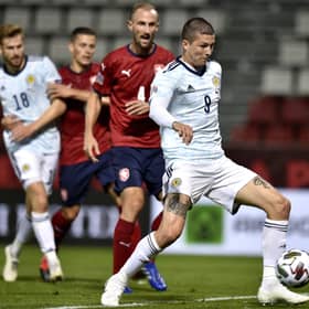 Lyndon Dykes sweeps the ball home for his first Scotland goal. Picture: Radek Petrasek/PA