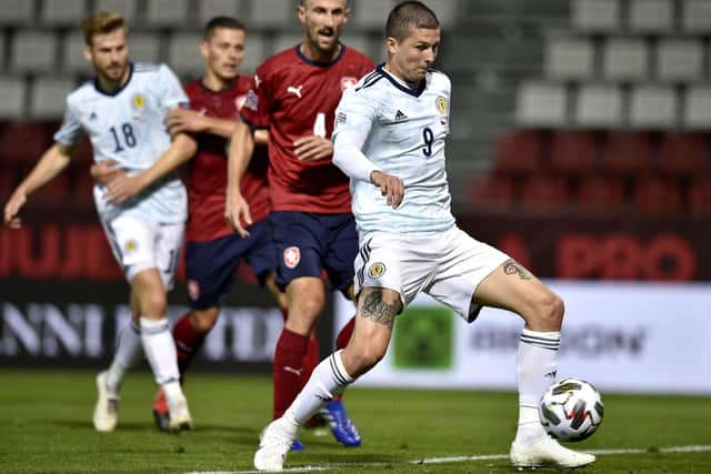 Lyndon Dykes sweeps the ball home for his first Scotland goal. Picture: Radek Petrasek/PA