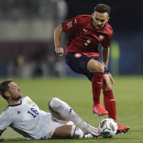 Scotland defender Liam Cooper slides in on Adam Karabec. Picture: Petr David/AP