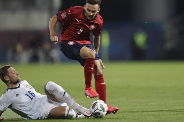 Scotland defender Liam Cooper slides in on Adam Karabec. Picture: Petr David/AP