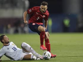 Scotland defender Liam Cooper slides in on Adam Karabec. Picture: Petr David/AP