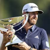 Dustin Johnson holds the FedEx Cup trophy aloft after winning the Tour Championship at Lake Golf Club in Atlanta on Monday. Picture: John Bazemore/AP