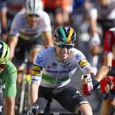 Second-placed Caleb Ewan, right, reaches out to congratulate stage winner Sam Bennett at the line. Picture: Christophe Ena/AP