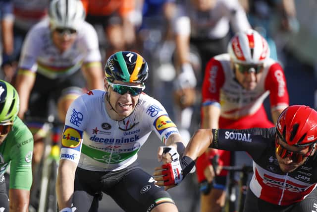 Second-placed Caleb Ewan, right, reaches out to congratulate stage winner Sam Bennett at the line. Picture: Christophe Ena/AP