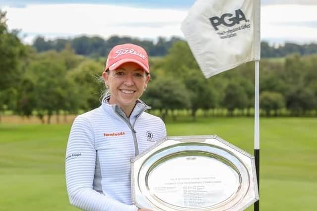 Heather MacRae with the trophy after her victory in the WPGA Championship.