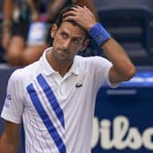 Novak Djokovic reacts after inadvertently hitting a line judge with a ball at the US Open. Picture: Seth Wenig/AP