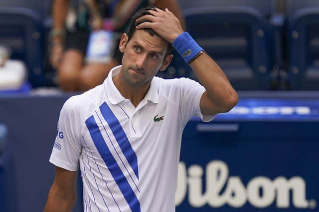 Novak Djokovic reacts after inadvertently hitting a line judge with a ball at the US Open. Picture: Seth Wenig/AP