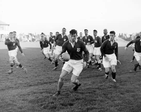 Christy Elliot keeps his eye on the ball during an Edinburgh v South of Scotland match in 1957