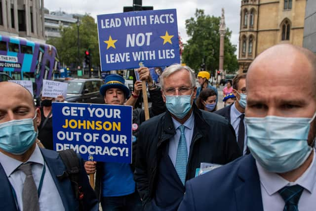 The European Unions chief negotiator, arrives with members of his team for key trade talks