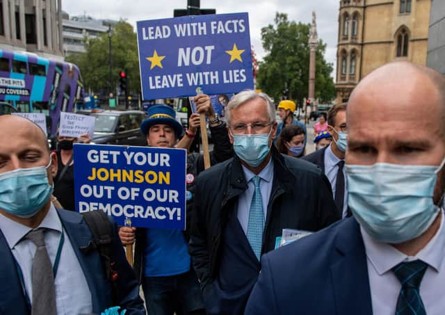 The European Unions chief negotiator, arrives with members of his team for key trade talks