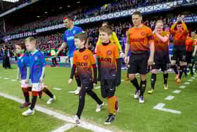 The teams emerge from the Ibrox tunnel the last  time Rangers and Dundee United played, in 2014.  Picture: Sammy Turner/SNS