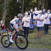 Fans at the roadside applaud as Marc Hirschi climbs his way to victory in Sarran Correze. Picture: Thibault Camus/AP