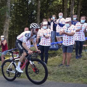 Fans at the roadside applaud as Marc Hirschi climbs his way to victory in Sarran Correze. Picture: Thibault Camus/AP