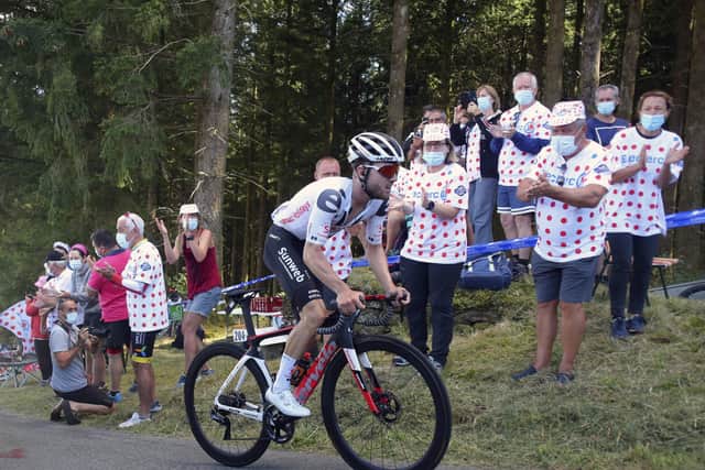 Fans at the roadside applaud as Marc Hirschi climbs his way to victory in Sarran Correze. Picture: Thibault Camus/AP