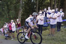 Fans at the roadside applaud as Marc Hirschi climbs his way to victory in Sarran Correze. Picture: Thibault Camus/AP