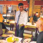 Rishi Sunak serves customers at Wagamama without a mask.  Picture: Simon Walker/
HM Treasury