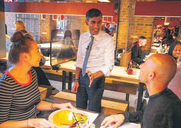 Rishi Sunak serves customers at Wagamama without a mask. Picture: Simon Walker/
HM Treasury