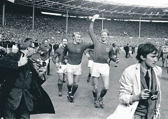 England defender Jack Charlton holds aloft the World Cup trophy at Wembley in 1966. Picture: PA Wire.