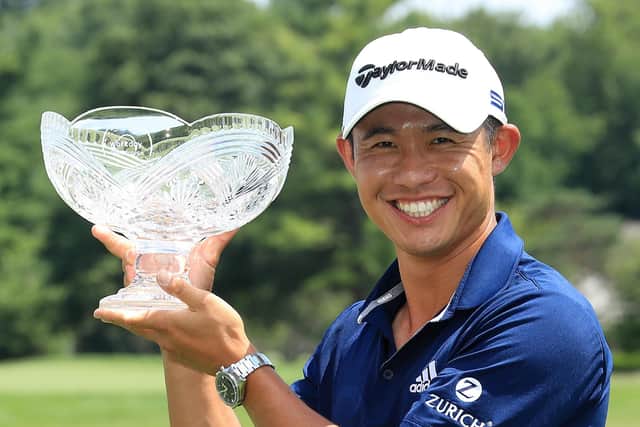 Collin Morikawa celebrates with the winner's trophy after winning the Workday Charity Open