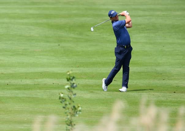 Marc Warren plays a shot on the fifth hole en route to winning the Austrian Open, a result which means that the Scot can skip this week’s Euram Bank Open. Picture: Stuart Franklin/Getty Images