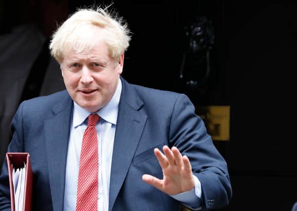 Boris Johnson and his Home Secretary Priti Patel need to rethink their attitude to immigration by care sector workers (Picture: Tolga Akmen/AFP via Getty Images)