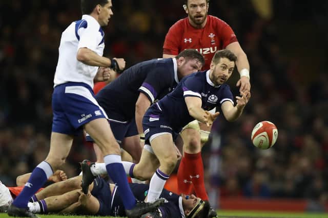 Greig Laidlaw gets a pass away as Alun-Wyn Jones watches in Cardiff during the 2018 Six Nations. Picture: David Rogers/Getty