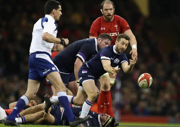 Greig Laidlaw gets a pass away as Alun-Wyn Jones watches in Cardiff during the 2018 Six Nations. Picture: David Rogers/Getty