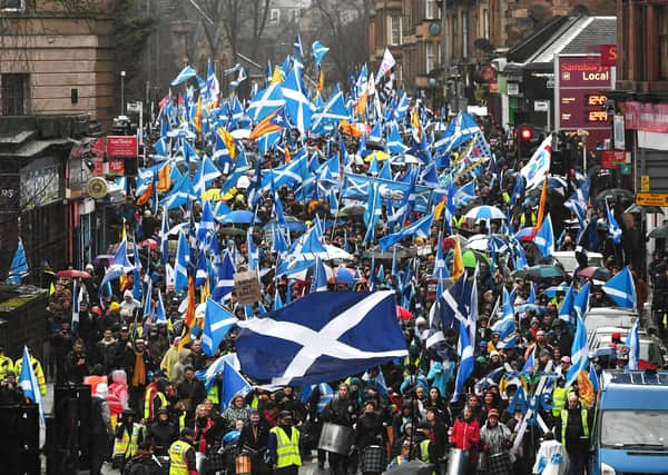 Independence supporters march through Glasgow