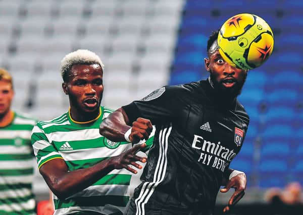 Moussa Dembele, right, vies for the ball with Celtic FC's Belgian defender Boli Bolingoli-Mbombo. Picture Jeff Pachoud/AFP via Getty Images