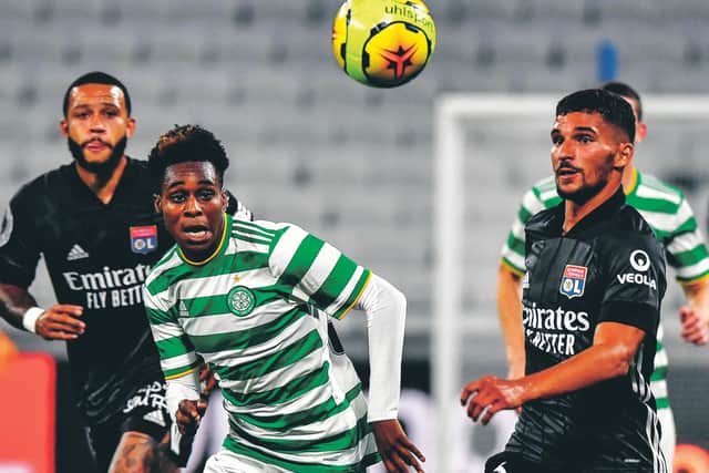 Lyon's Houssem Aouar keeps an eye on Celtic's Dutch defender Jeremie Frimpong. Picture: Jeff Pachoud/AFP/Getty