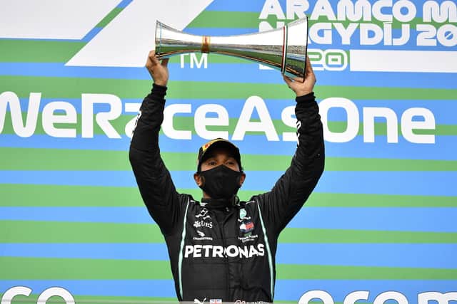 Mercedes driver Lewis Hamilton celebrates after winning the Hungarian Grand Prix at the Hungaroring racetrack. Picture: Joe Klamar/Pool via AP