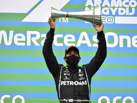 Mercedes driver Lewis Hamilton celebrates after winning the Hungarian Grand Prix at the Hungaroring racetrack. Picture: Joe Klamar/Pool via AP
