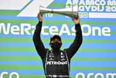 Mercedes driver Lewis Hamilton celebrates after winning the Hungarian Grand Prix at the Hungaroring racetrack. Picture: Joe Klamar/Pool via AP