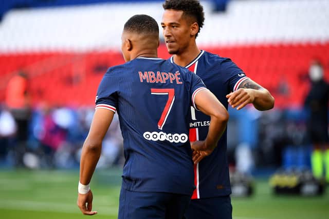 PSG's Kylian Mbappe is congratulated by defender Thilo Kehrer after his early opener. Picture: Franck Fife/AFP via Getty Images