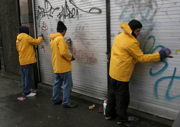 Offenders doing community service. Picture: Richard Gardner