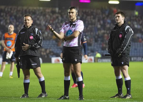 Referee Marius Mitrea and his assistants consult the TMO during Edinburgh’s match against Connacht at BT Murrayfield in February. Picture: SNS/SRU.