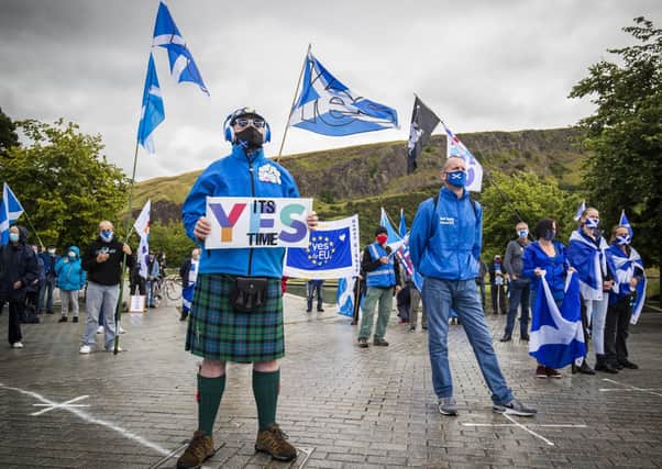 Members from All Under One Banner take part in a static demonstration for Scottish independence outside the Scottish Parliament in Edinburgh.