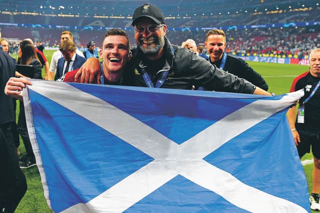 Andy Robertson smiles and Jurgen Klopp flashes his cartoon gnashers after Liverpool’s 2019 Champions League win. Picture: Andrew Powell/Getty Images