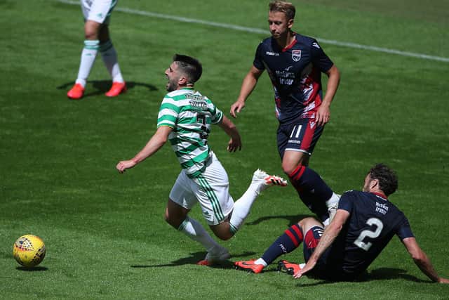 Greg Taylor, who sustained an ankle injury which forced his withdrawal, is tackled by Connor Randall during Celtic’s 3-0 pre-season friendly victory over Ross CountY. Picture: Getty.