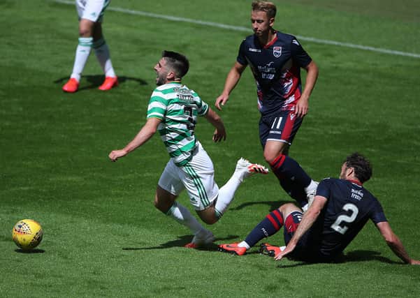 Greg Taylor, who sustained an ankle injury which forced his withdrawal, is tackled by Connor Randall during Celtic’s 3-0 pre-season friendly victory over Ross CountY. Picture: Getty.