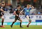 Finlay Christie of the Blues puts in a kick during the Super Rugby Aotearoa match against the Chiefs at Eden Park. Picture: Anthony Au-Yeung/Getty Images