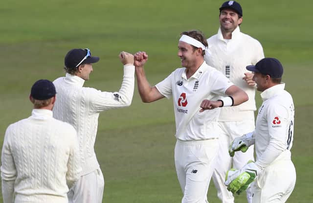 Stuart Broad, centre, celebrates with his England team-mates after dismissing West Indies' John Campbell during the third day of the third Test at Old Trafford. Picture: Michael Steele/Pool via AP