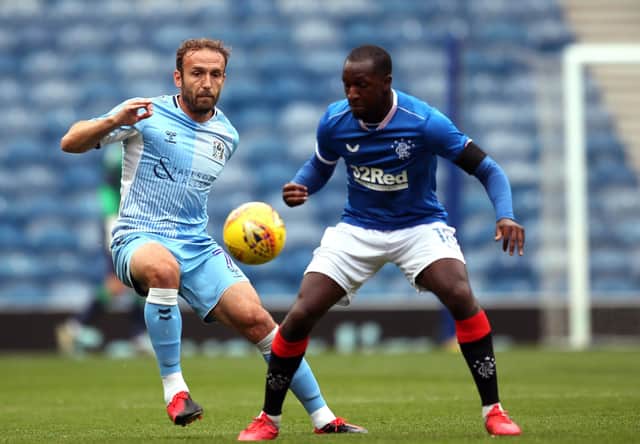 Coventry City's Liam Kelly, left, and Rangers' Glen Kamara battle for the ball during the pre-season friendly at Ibrox on Saturday. Picture: Jane Barlow/PA Wire