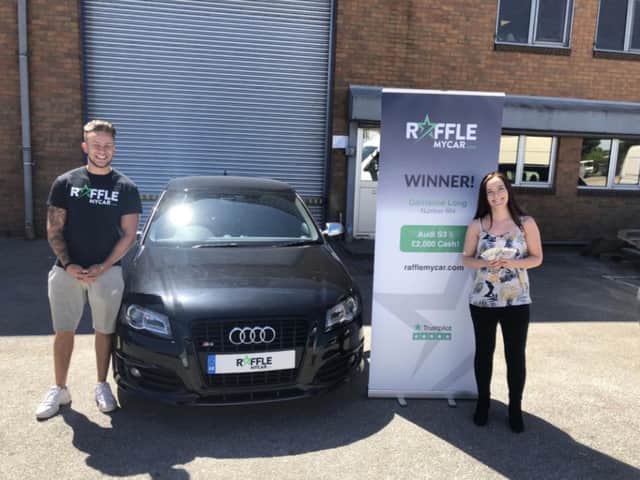 Audi car and 2,000 cash prize winner Carrianne Long from Lincoln with RaffleMyCar's Joey Doyle